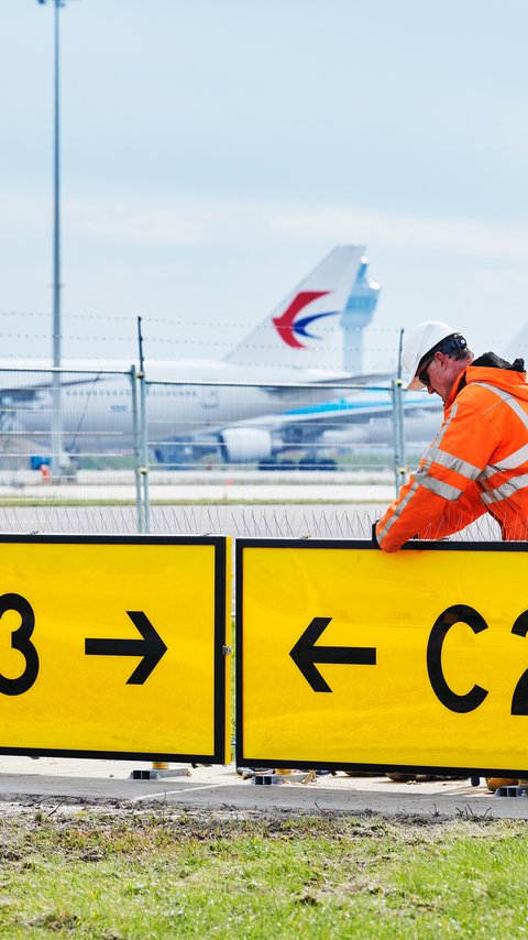 Heijmans collega aan het werk voor Schiphol